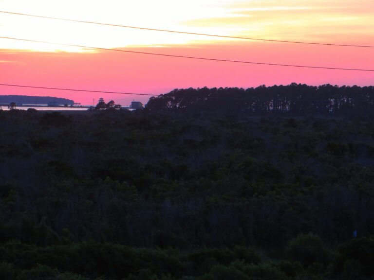 Sunset over Pamlico Sound near Camp Hatteras RV Resort, an oceanfront-to-soundside park on Hatteras Island, Outer Banks