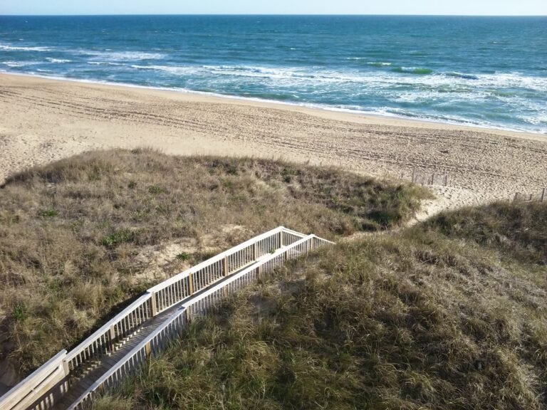Boardwalk leading down to an empty beach at Kill Devil Hills shore, near Joe & Kay’s Campground