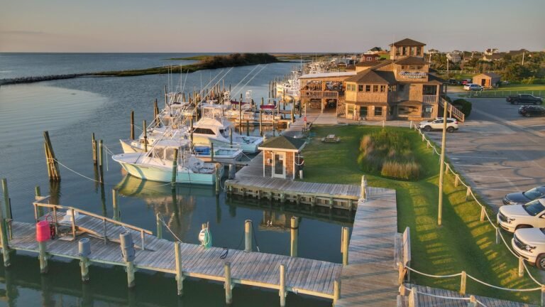 White and blue boat moored at a dock during daytime, Outer Banks