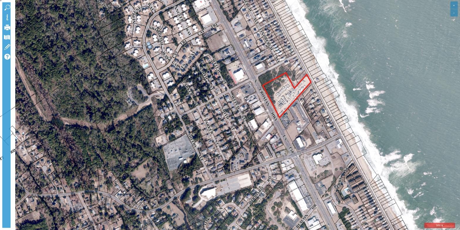 Aerial view of Kitty Hawk RV Park at 3945 N Croatan Highway, Kitty Hawk NC, showing RV sites between the neighborhood and the Atlantic Ocean beachfront