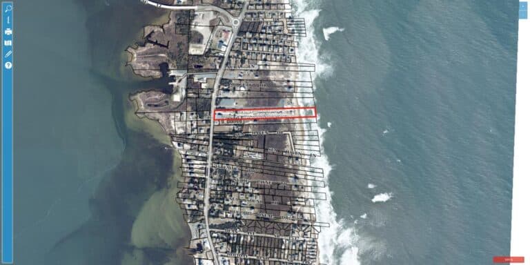 Aerial view of North Beach Campground in Rodanthe on Hatteras Island, showing RV and camper sites on an oceanfront parcel between NC Highway 12 and the Atlantic Ocean
