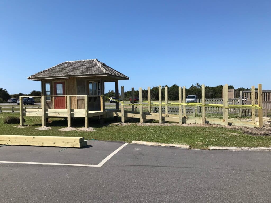 A covered wooden information and registration kiosk at the NPS Ocracoke Campground.