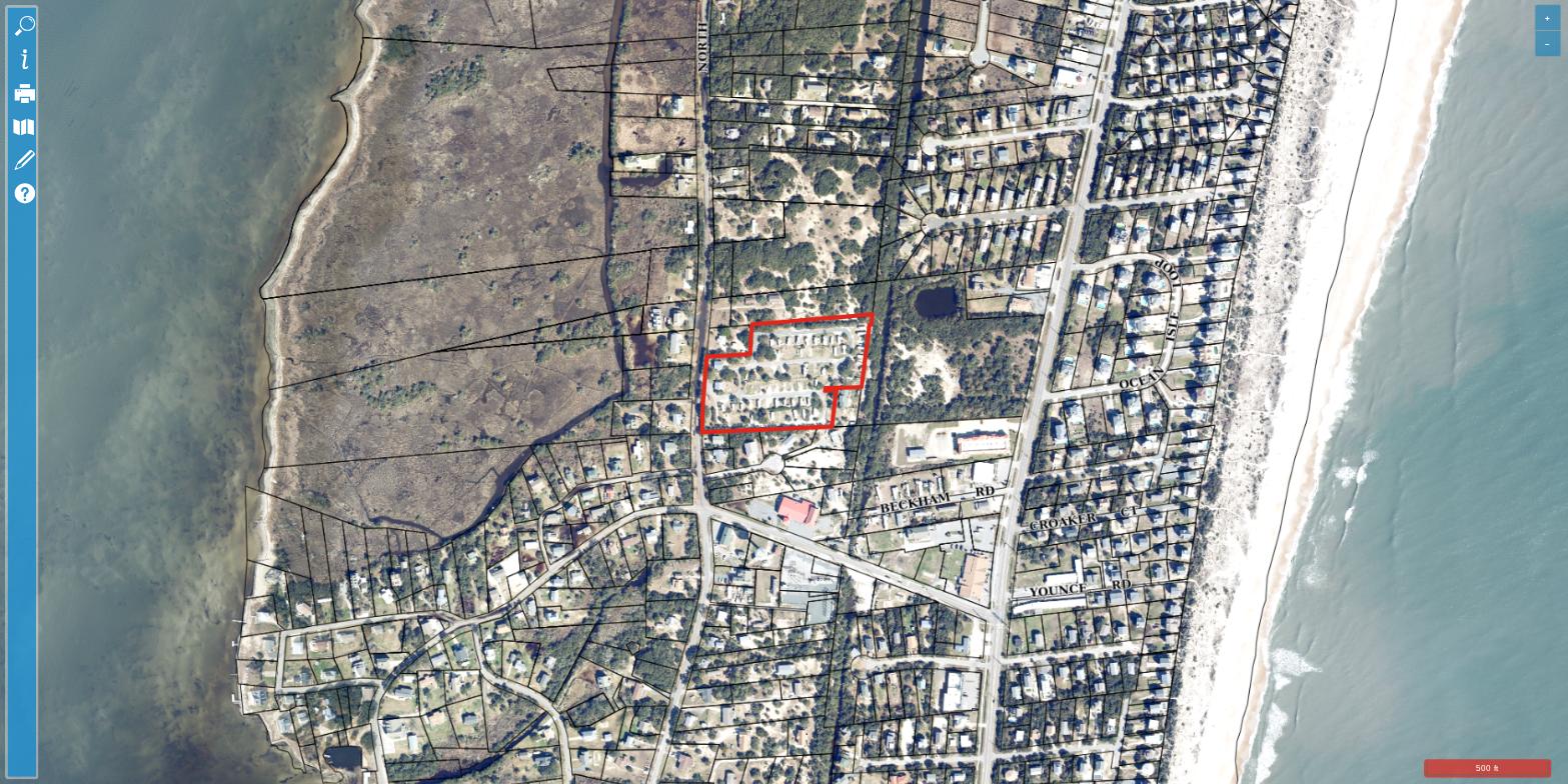 Aerial view of Sands of Time Campground at 40523 North End Road, Avon, NC on Hatteras Island, showing RV and camper sites between the Pamlico Sound and the Atlantic Ocean, with the parcel boundary outlined.