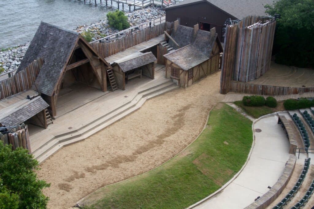 The open-air Waterside Theatre stage set among trees beside Roanoke Sound.